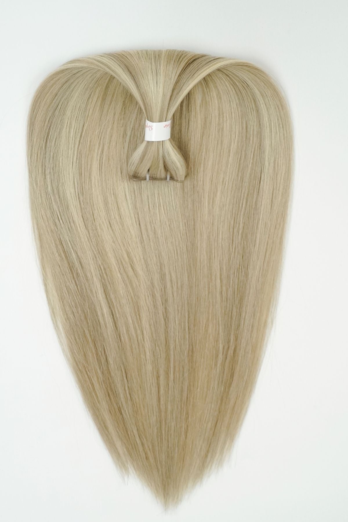 Genius weft hair extensions are virtually undetectable, seamless, and super blendable. The Genius Hand-Tied extensions are a brilliant new weft design that can be cut directly anywhere on the seam without the weft unravelling! The track is minuscule compared to machine-made wefts making this option ideal for people with thin to medium hair. The Genius Weft extensions give you the freedom to customize every sew-in hair transformation.